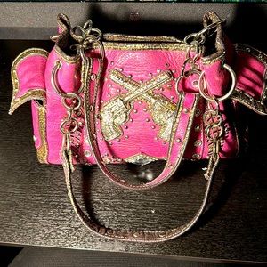 Women’s  pink studded crossed guns handbag